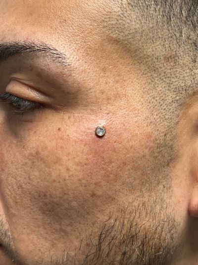 Dermal piercing with Implant Grade Titanium Surface Jewelry by Other by Harley at Platinum Tattoos & Piercings, San Antonio TX