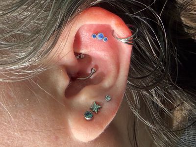 Flat piercing with Implant Grade Titanium Cluster/Multi-Gem by NeoMetal by Mingo at Platinum Tattoos & Piercings, San Antonio TX
