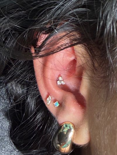 Conch piercing with Implant Grade Titanium Cluster/Multi-Gem by NeoMetal by Mingo at Platinum Tattoos & Piercings, San Antonio TX