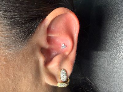 Conch piercing with Implant Grade Titanium Cluster/Multi-Gem by NeoMetal by Mingo at Platinum Tattoos & Piercings, San Antonio TX