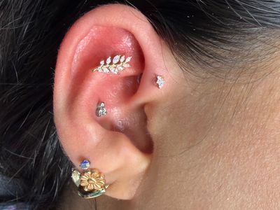 Curated ear piercing setup — 1st Forward Helix, Flat with 14k White Gold, 14k Yellow Gold Cluster/Multi-Gem by Buddha Jewelry by Mingo at Platinum Tattoos & Piercings, San Antonio TX