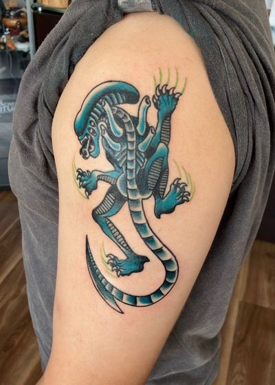 Black Xenomorph tattoo on the Outer Bicep by Jr at Platinum Tattoos & Piercings, San Antonio TX