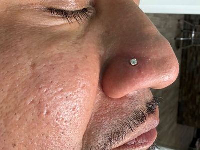 Nostril piercing with 14k Yellow Gold Labret Stud/Flat Back by Other by Mingo at Platinum Tattoos & Piercings, San Antonio TX
