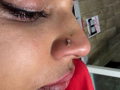 Nostril piercing with 14k Yellow Gold Cluster/Multi-Gem by Other by Mingo at Platinum Tattoos & Piercings, San Antonio TX