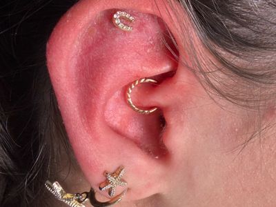 Daith piercing with 14k Yellow Gold Hoop/Ring by Other by Mingo at Platinum Tattoos & Piercings, San Antonio TX