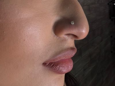Nostril piercing with Implant Grade Titanium Labret Stud/Flat Back by NeoMetal by Mingo at Platinum Tattoos & Piercings, San Antonio TX