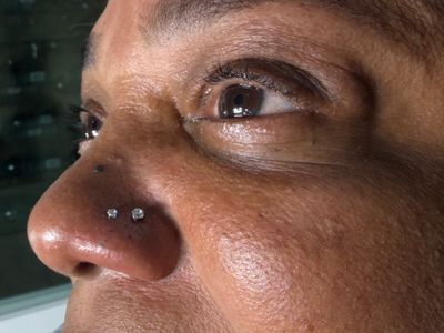 Double Nostril piercing with Implant Grade Titanium Labret Stud/Flat Back by NeoMetal by Mingo at Platinum Tattoos & Piercings, San Antonio TX