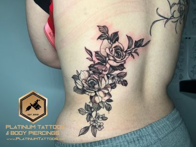 Floral & Black & Grey & Dotwork tattoo on the lower back by Jesus at Platinum Tattoos Piercings, San Antonio TX