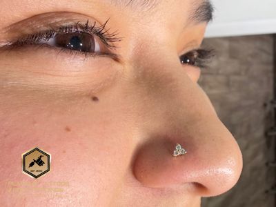 Nostril piercing with 14k Yellow Gold Cluster/Multi-Gem by Junipurr by Mingo at Platinum Tattoos & Piercings, San Antonio TX