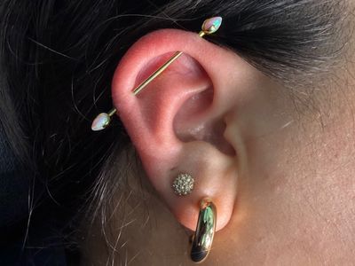 Industrial piercing with Implant Grade Titanium Barbell by Industrial Strength by Mingo at Platinum Tattoos & Piercings, San Antonio TX