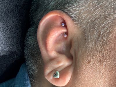 Rook piercing with Implant Grade Titanium Curved Barbell by NeoMetal by Mingo at Platinum Tattoos & Piercings, San Antonio TX