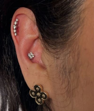 Curated ear piercing setup — 1st Helix, Conch with Implant Grade Titanium Cluster/Multi-Gem by NeoMetal by Mingo at Platinum Tattoos & Piercings, San Antonio TX