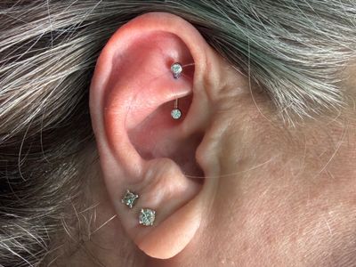 Rook piercing with Implant Grade Titanium Curved Barbell by NeoMetal by Mingo at Platinum Tattoos & Body Piercings, San Antonio TX
