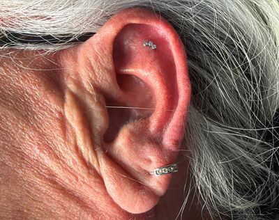 Flat piercing with Implant Grade Titanium Cluster/Multi-Gem by NeoMetal by Mingo at Platinum Tattoos & Body Piercings, San Antonio TX