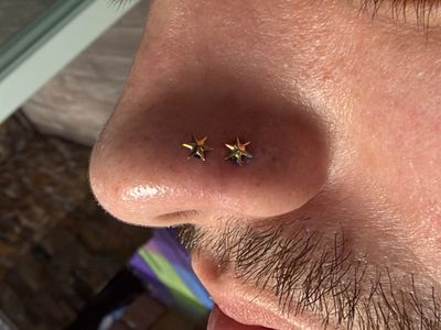 Double Nostril piercing with 14k Yellow Gold Labret Stud/Flat Back by Anatometal by Mingo at Platinum Tattoos & Body Piercings, San Antonio TX