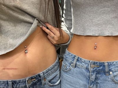 Belly Button piercing with Implant Grade Titanium Curved Barbell by Other by Mingo at Platinum Tattoos & Body Piercings, San Antonio TX