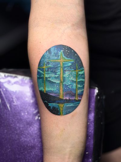 Color Blue, Purple, Green, Multi-Color Cross tattoo on the Forearm by Jr at Platinum Tattoos & Body Piercings, San Antonio TX