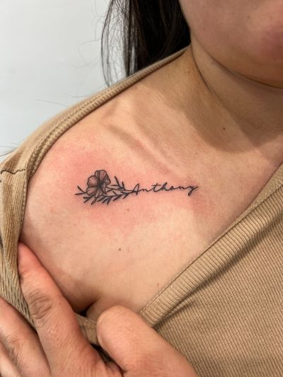 Black & Grey, Fine Line, Floral, Lettering, Linework, Minimalist, Script Flower, Script/Cursive tattoo on the Clavicle by Jesus at Platinum Tattoos & Body Piercings, San Antonio TX