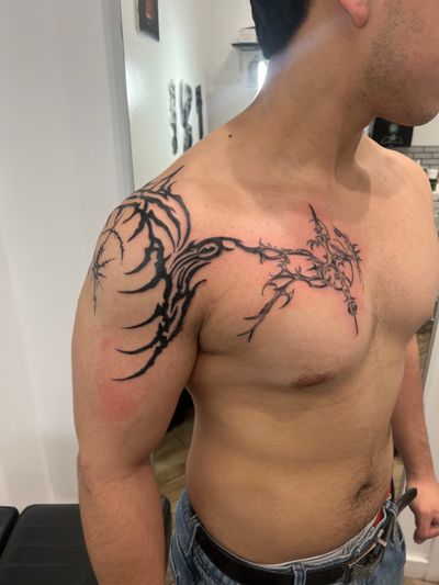 Blackwork, Ornamental, Tribal Black tattoo on the Chest and Clavicle by Jesus at Platinum Tattoos & Body Piercings, San Antonio TX