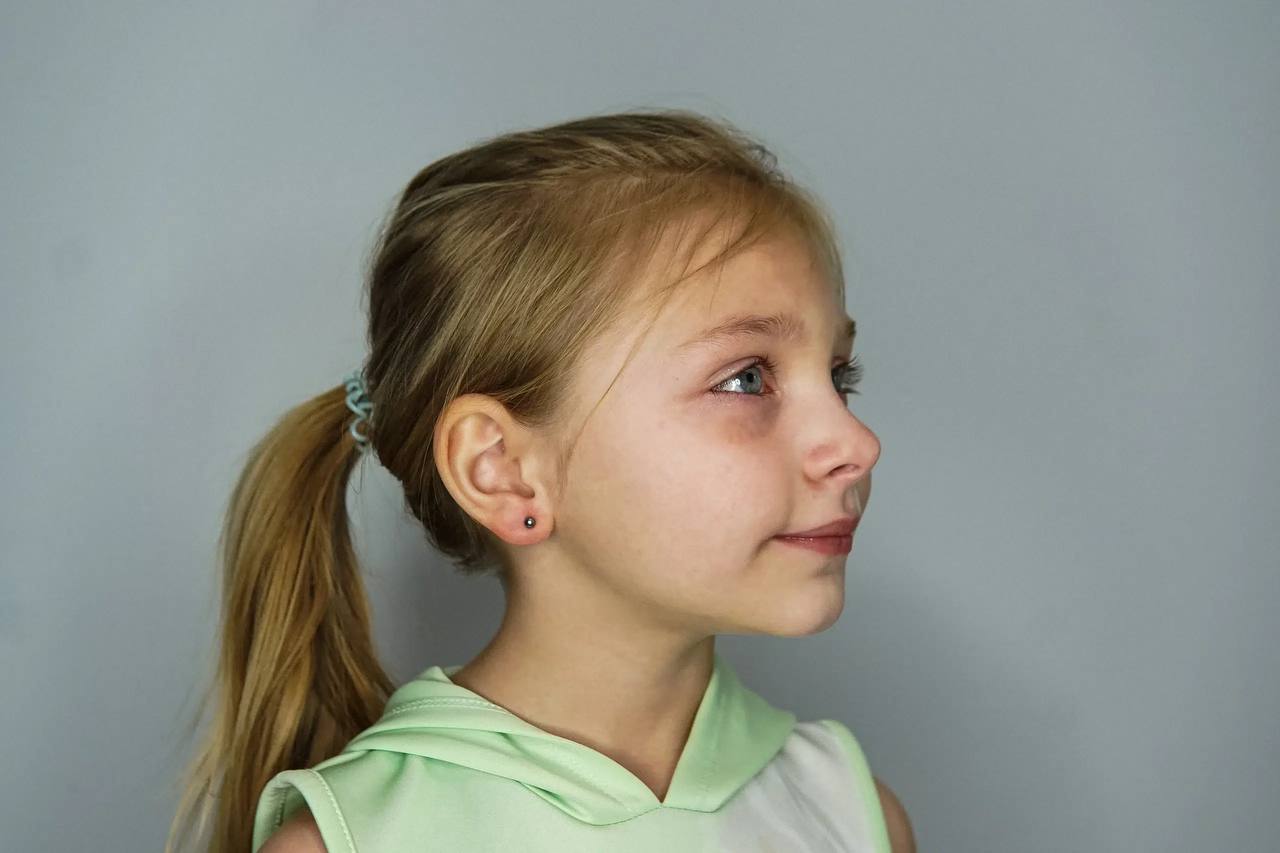 Girl with earlobe piercing stud at Platinum Body Piercings North Star Mall San Antonio