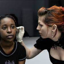Professional piercer preparing ear piercing at Platinum Body Piercings San Antonio